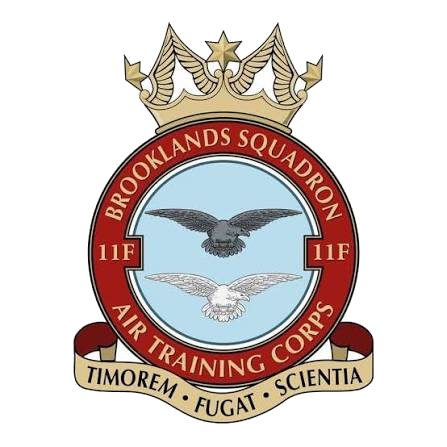The 11F (Brooklands) Squadron crest: a crowned badge reading Brooklands Squadron and Air Training Corps, with 11F either side of an eagle, above the motto Timorem Fugat Scientia
